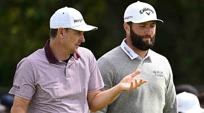 Justin Rose of England and Jon Rahm of Spain interact during Day Two of The 151st Open at Royal Liverpool Golf Club on July 21, 2023 in Hoylake, England.